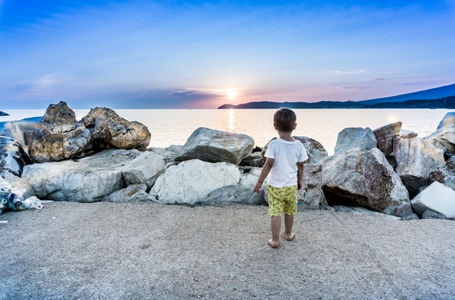 kid in board shorts