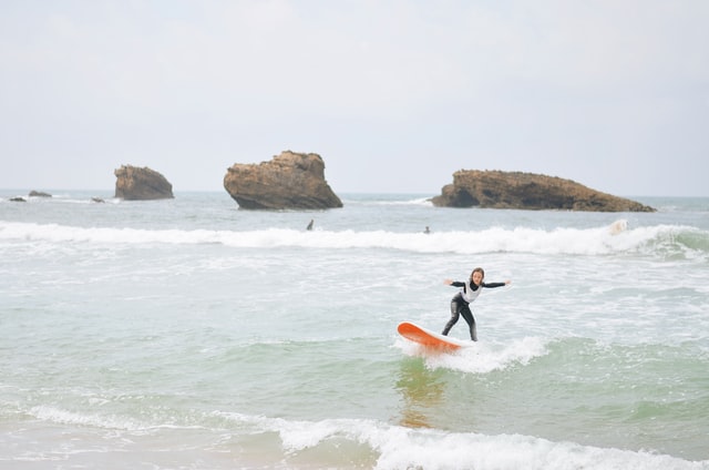 kid learning to surf